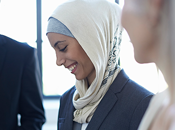 Woman Wearing Al-Amira Hijab Smiling and Looking Down
